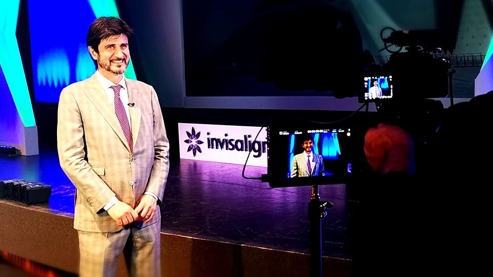Man interviewed on camera at event