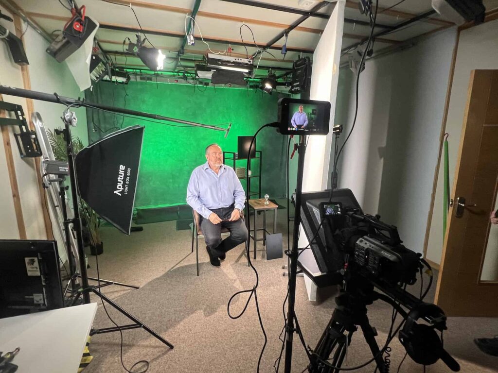 Videogrpaher shoots interview in studio